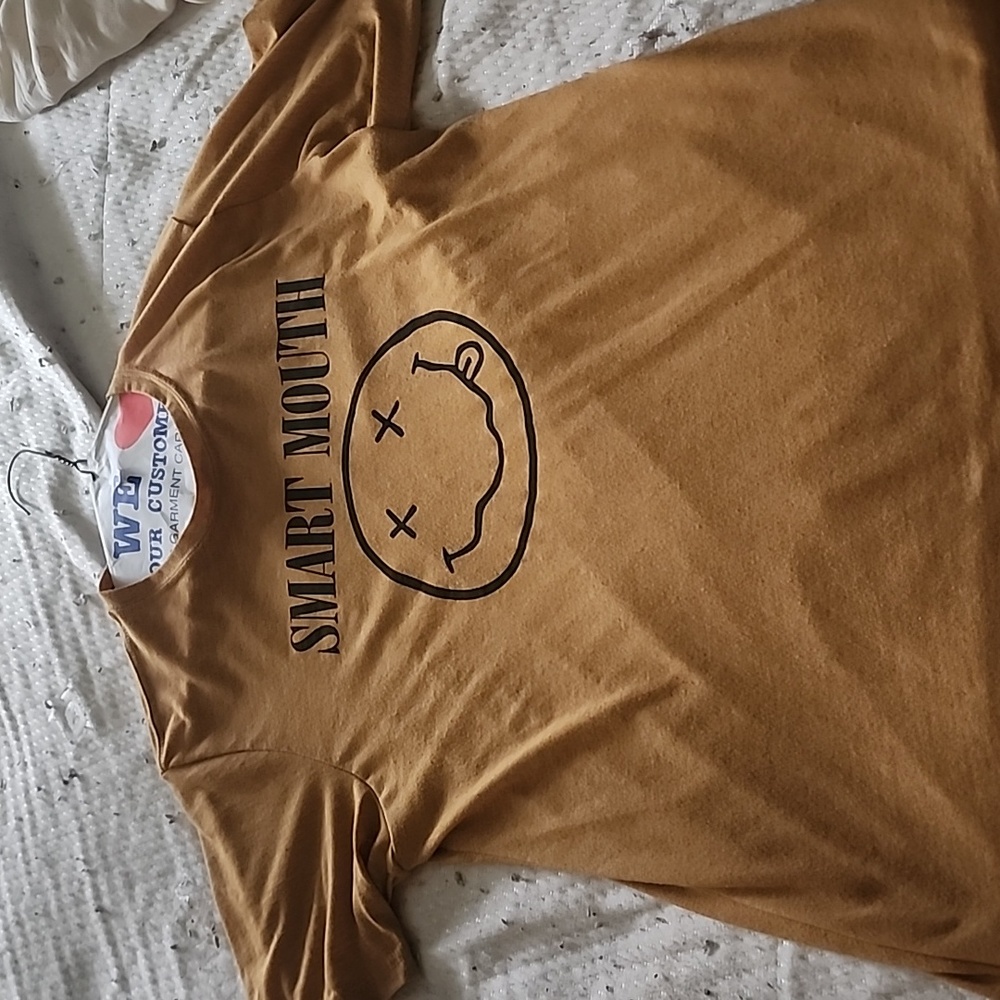 T-shirt, brand is "next level", size medium, mustard color